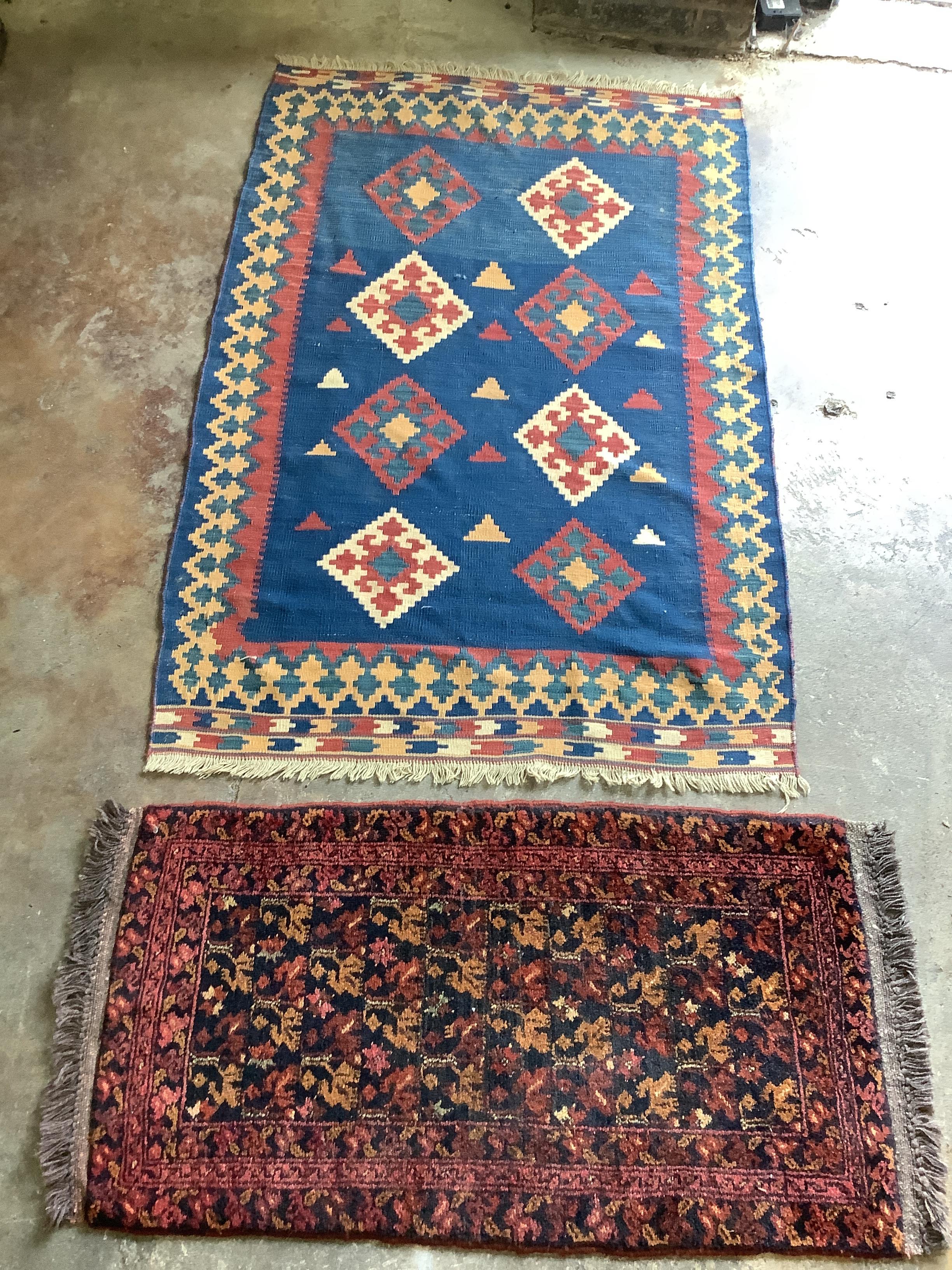 A Kelim polychrome flatweave rug and a Belouch mat, larger 152 x 90cm